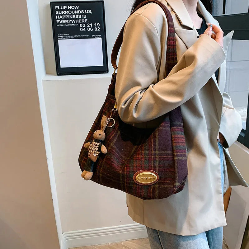 Women's large soft woolen cross-body shoulder bag in a horizontal square shape, shown in a choice of colours.