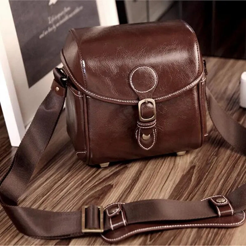 Fashion single shoulder SLR camera liner bag in PU leather, small size, dark coffee colour, for home storage.