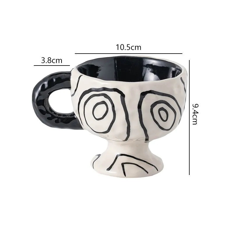 Hand-pinched irregular shaped ceramic mug in a solid colour on a plain background.