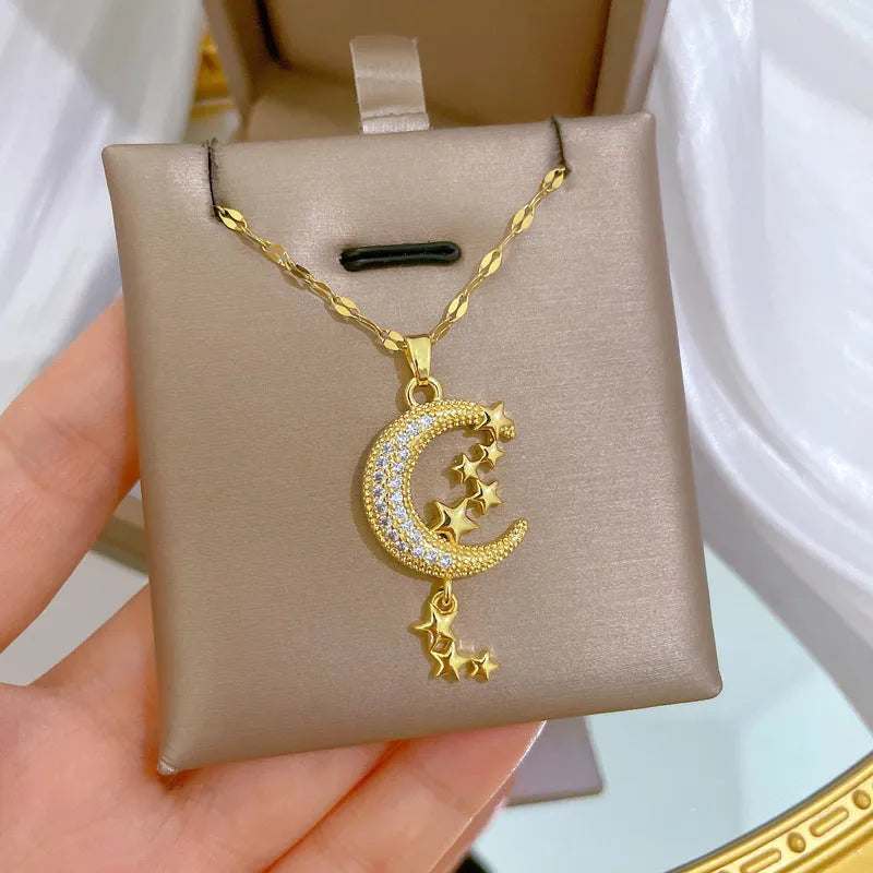 A218 geometric moon pendant necklace with diamond-cut facets and a dangling tassel on a silver chain.