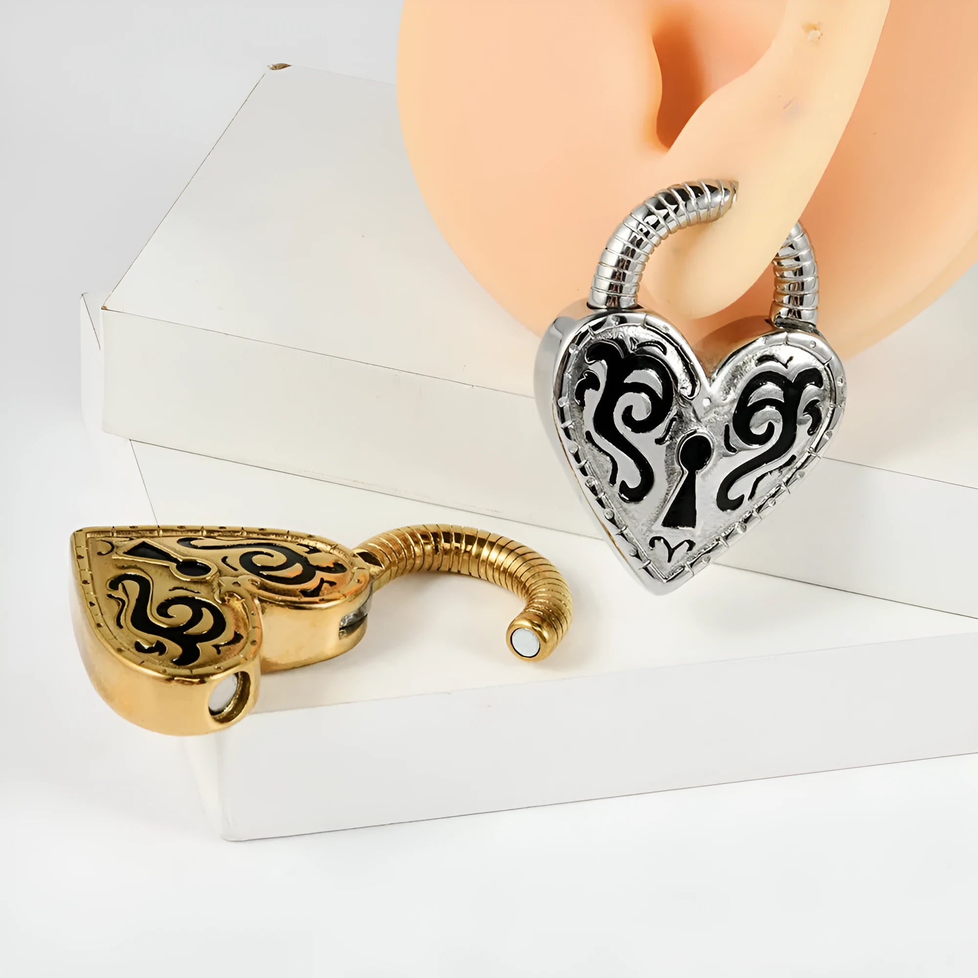 Women's heart-shaped stainless steel ear piercing earrings in gold or steel colour