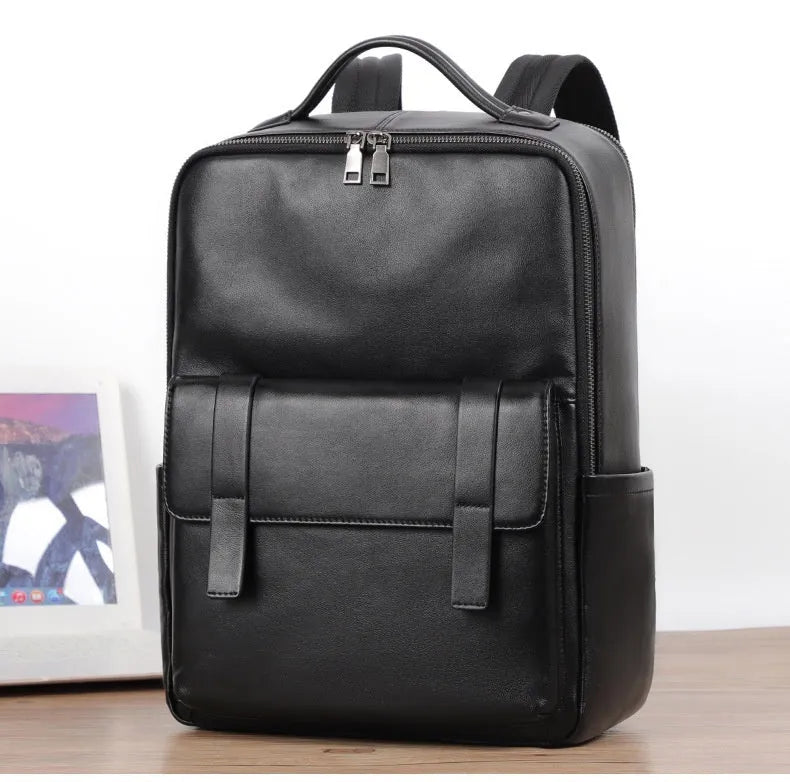Black genuine leather computer backpack with 36-55 litre capacity and physiological curve back plate