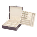 Green crocodile pattern leather double layer wooden jewellery box with lock open, showing storage compartments.