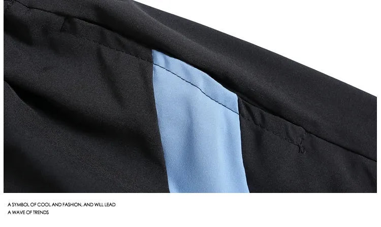 Black quick-drying sports shorts with elastic waistband and loose straight-leg design