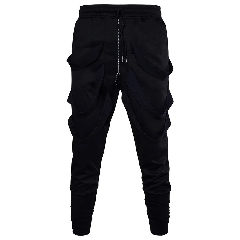 Men's black low crotch cross trousers with tapered cone leg and small hem on a plain background