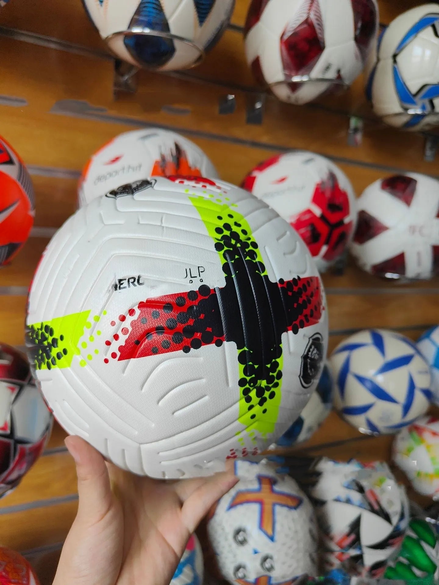 Fluorescent green Size 5 football with seamless construction for training and multi-sport use