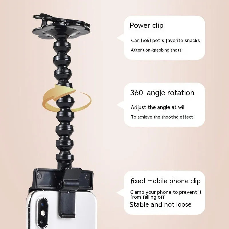 Pet photography tool clip for phone holding a treat to attract cat or dog attention, black plastic