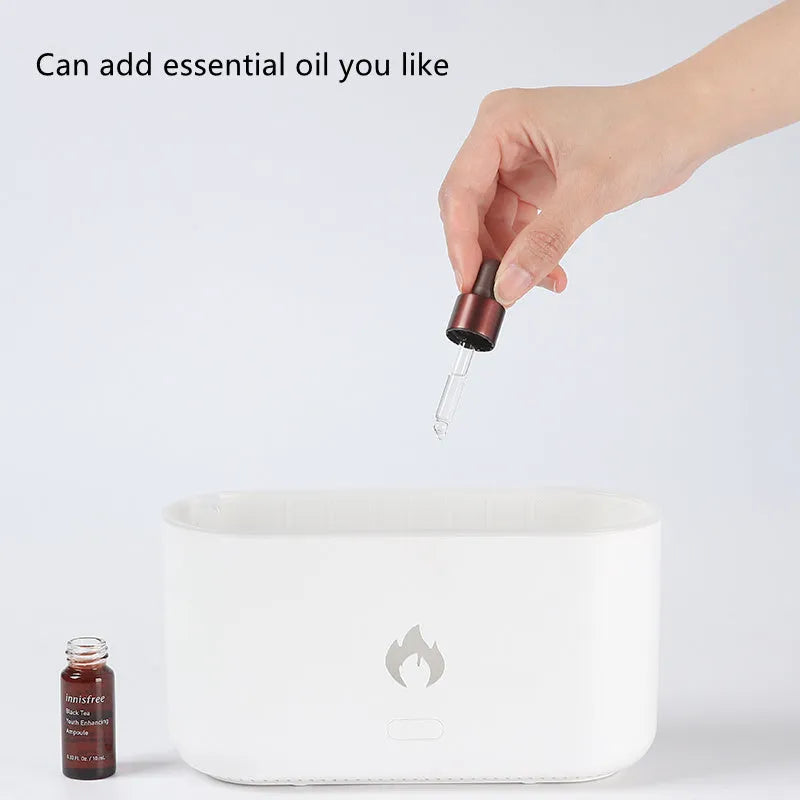 3D flame ultrasonic humidifier with 300ml water tank in white on a wooden desk