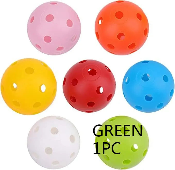 Assorted multi-colour 42mm golf practice balls with a net bag, shown next to practice putting holes.