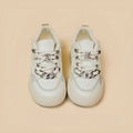 White casual women's low-top sneakers with flat heel and rubber sole