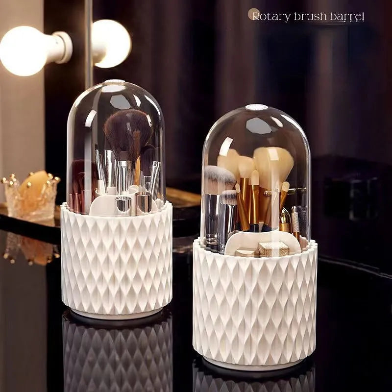 White acrylic rotating makeup brush holder with transparent dust cover showing split storage compartments