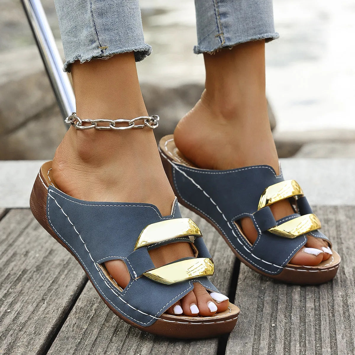 Roman style platform sandals in white, black, khaki, and blue on a solid colour background.