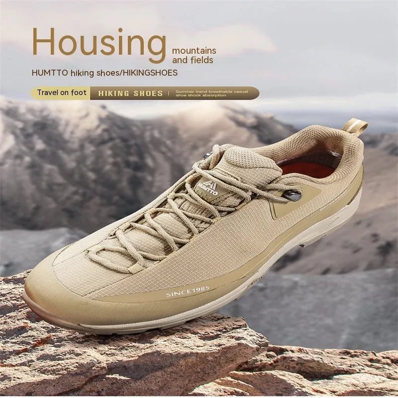 Men's low-top hiking boots in black with a rubber outsole and lace-up front.