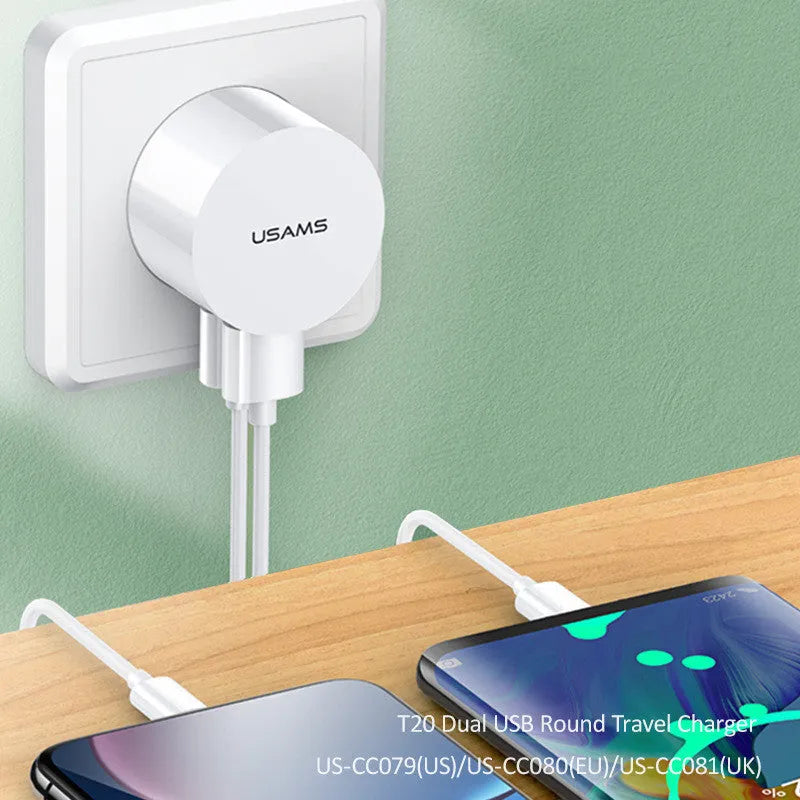 White dual USB phone charger with international plugs for US EU UK regions showing compact 39mm diameter design