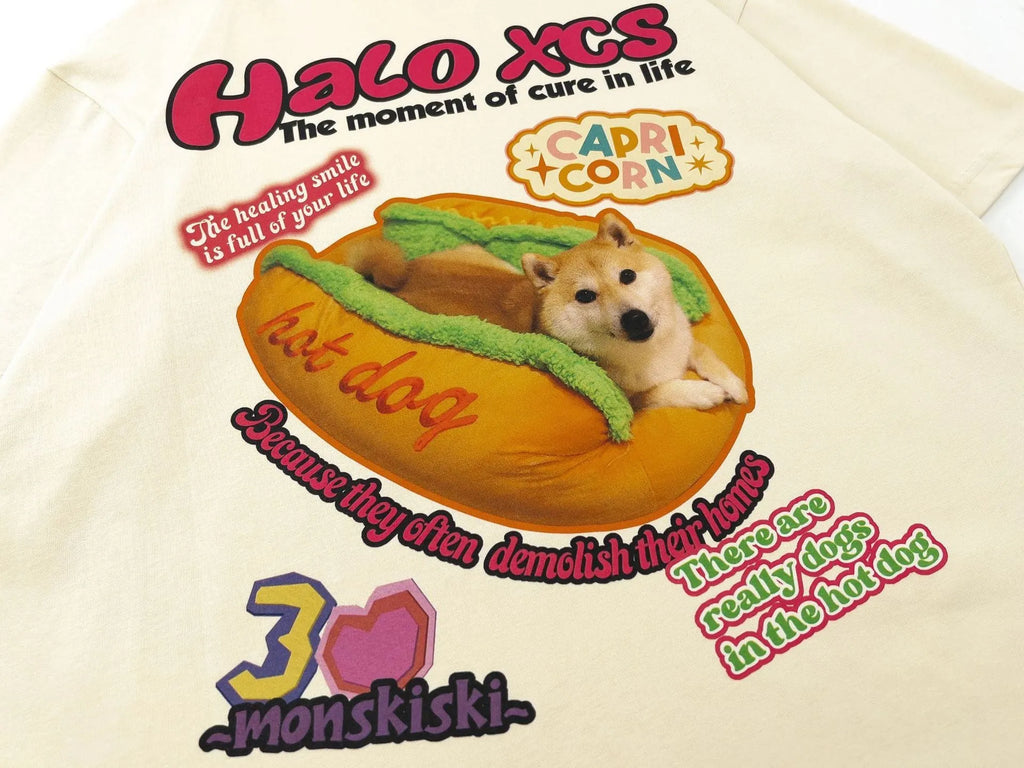 Cartoon hamburger dog print on a short-sleeved, loose-fit cotton T-shirt in white.