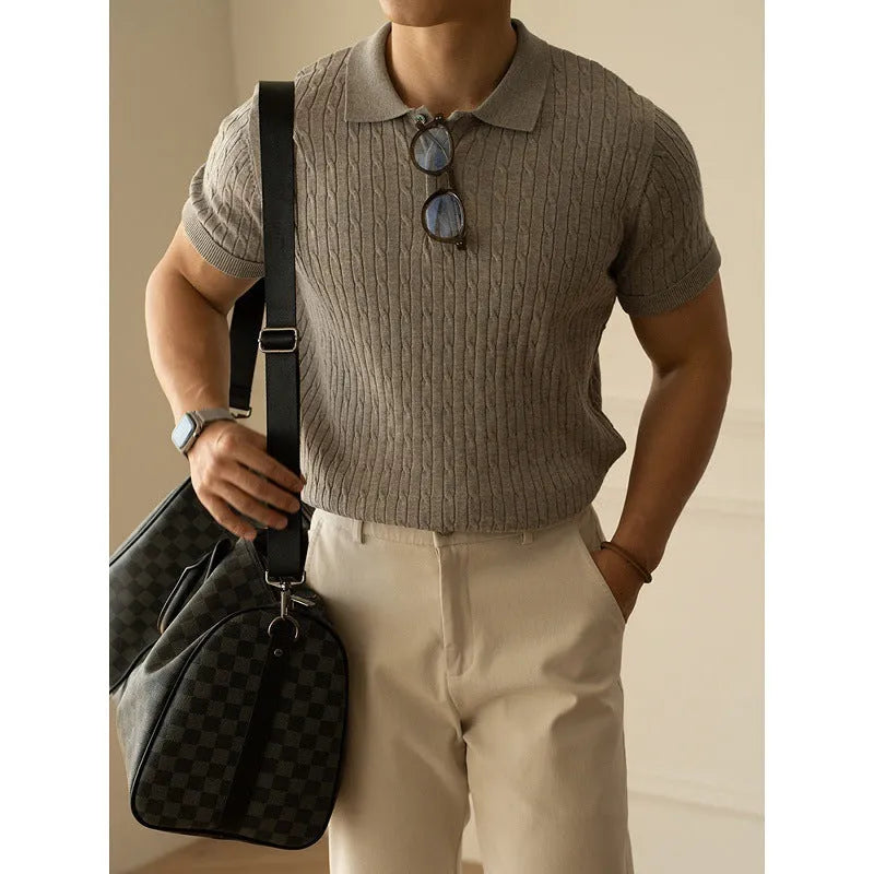 Men's khaki short sleeve business top on a hanger, showing the collar and button placket.