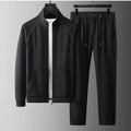 Men's slim fit stand collar tracksuit set in Vinylon fabric shown in black colour.