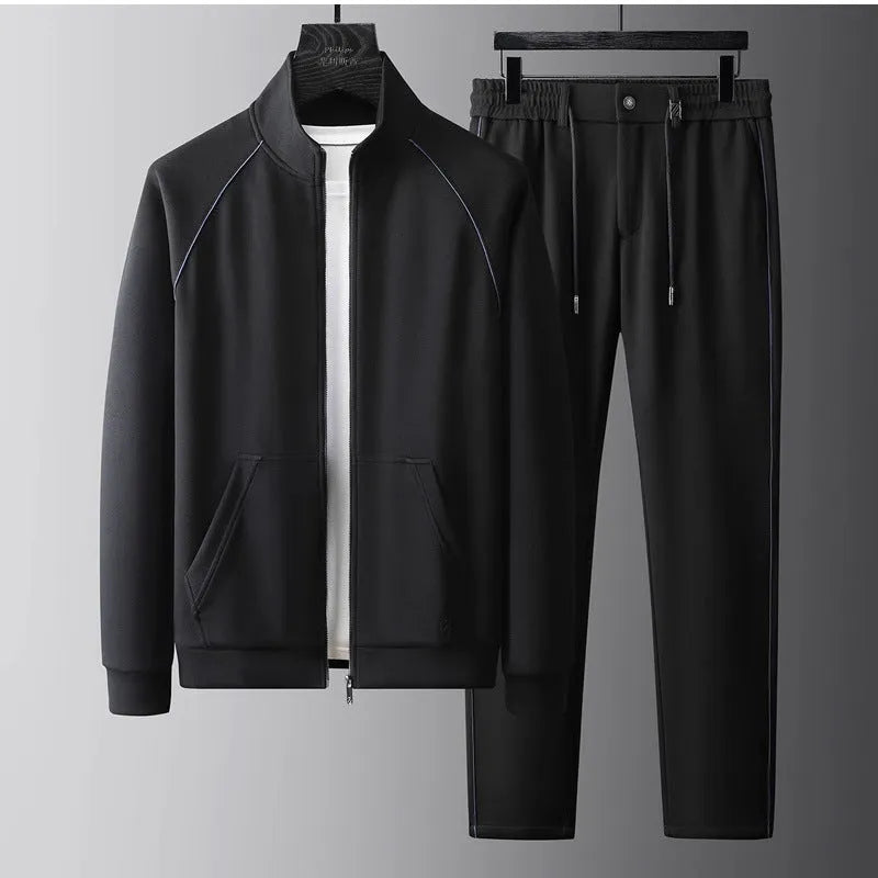 Men's slim fit stand collar tracksuit set in Vinylon fabric shown in black colour.