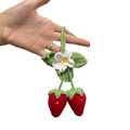 Handmade woven strawberry-shaped car pendant made from cotton and hemp knitting wool.