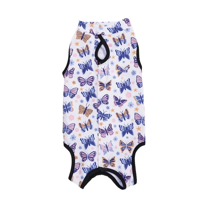 Cat wearing a printed post-operative sterilisation suit with Velcro fastenings.