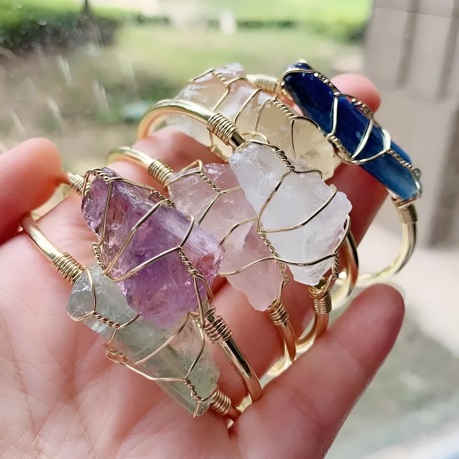 Gold winding geometric bracelet with natural crystal rough stones in bohemian ethnic design