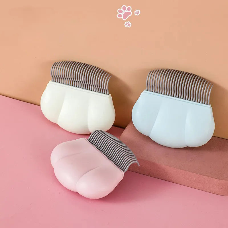 Paw soft deshedding brush for cats and dogs with rectangular blue head and silicone grip.