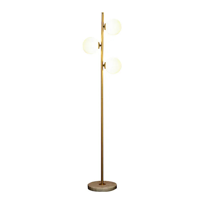 Creative minimalist floor lamp with warm LED light, gold aluminium alloy frame and glass shade