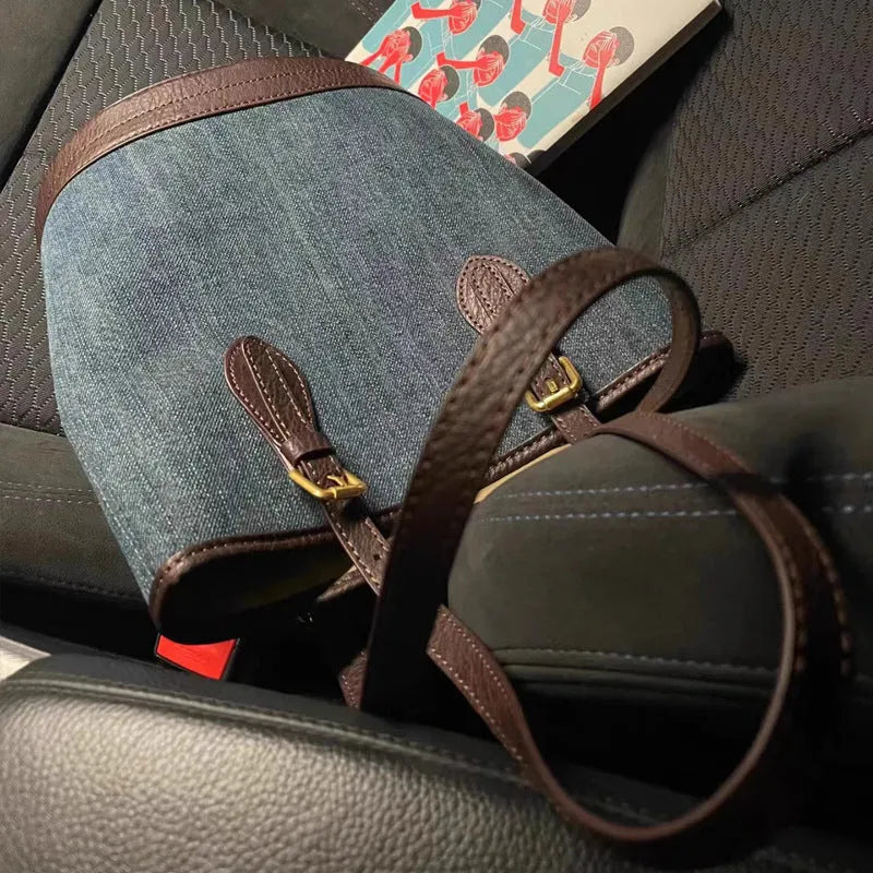Denim patchwork handbag with retro bucket design showing dimensions and one-shoulder strap