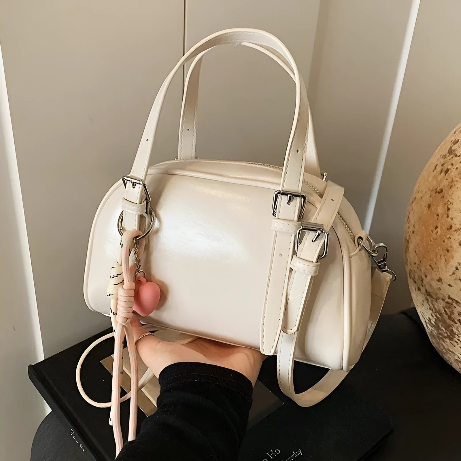 Soft black PU leather Korean-style shell-shaped women's shoulder bag with a pendant.