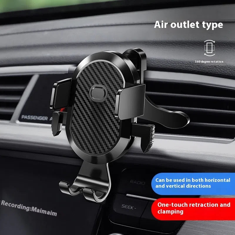 Black plastic manual car phone holder clipped to a vehicle air outlet vent