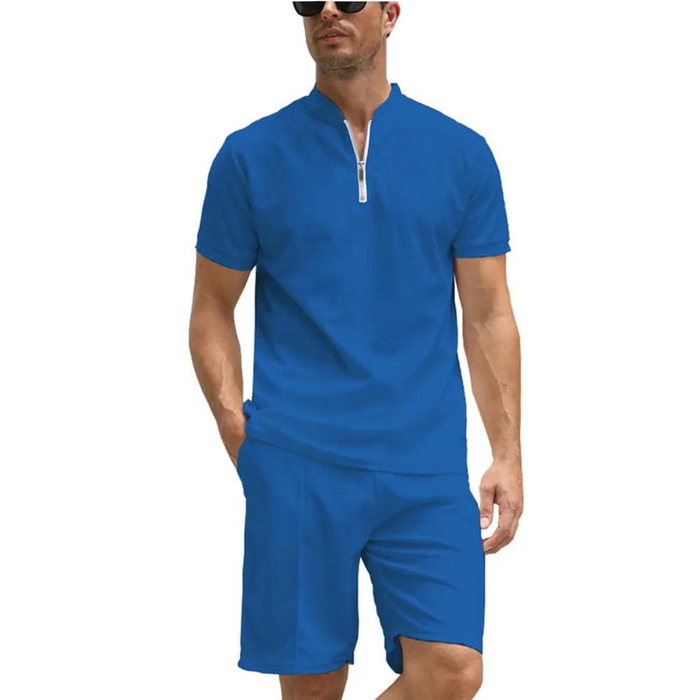 Men's solid colour polo shirt and matching trousers two-piece suit set on a hanger.