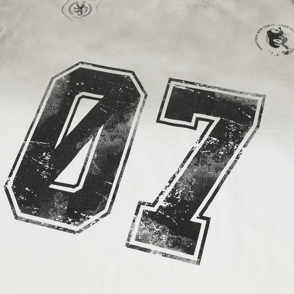 Men's short-sleeved printed cotton T-shirt on a hanger, shown in white and black colour options.