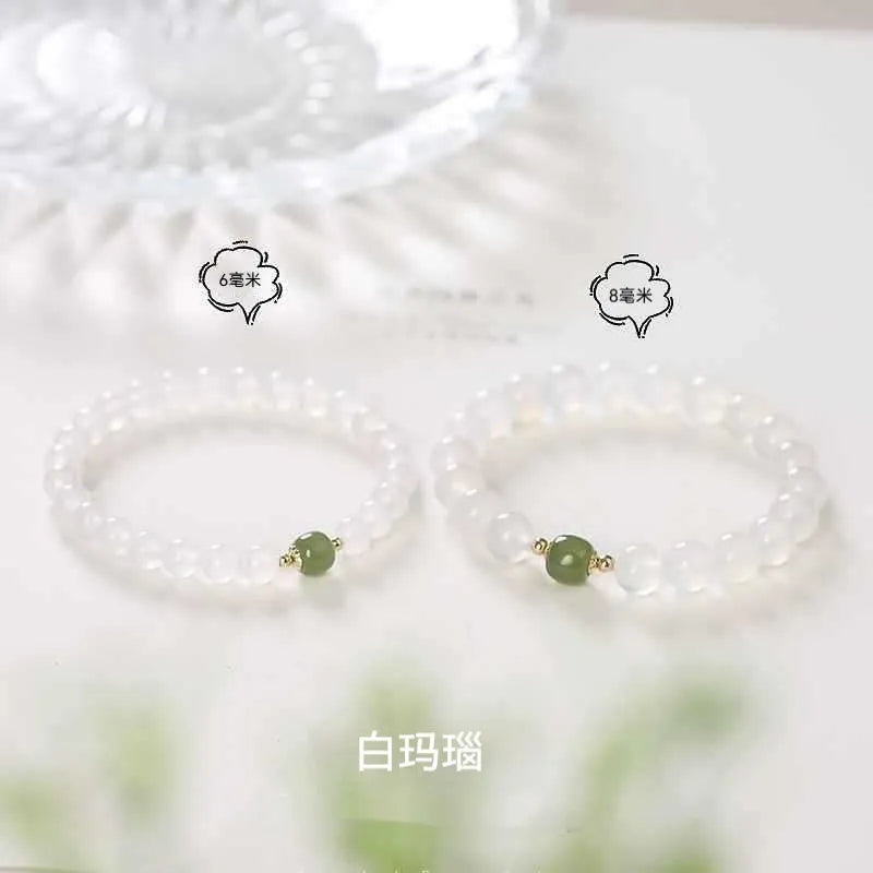 Handmade white agate bracelet with Hetian jade details and cinnabar inlays in 6mm and 8mm bead sizes