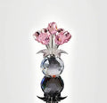Geometric K9 crystal glass rose decorative craft in multiple colour options on a table.