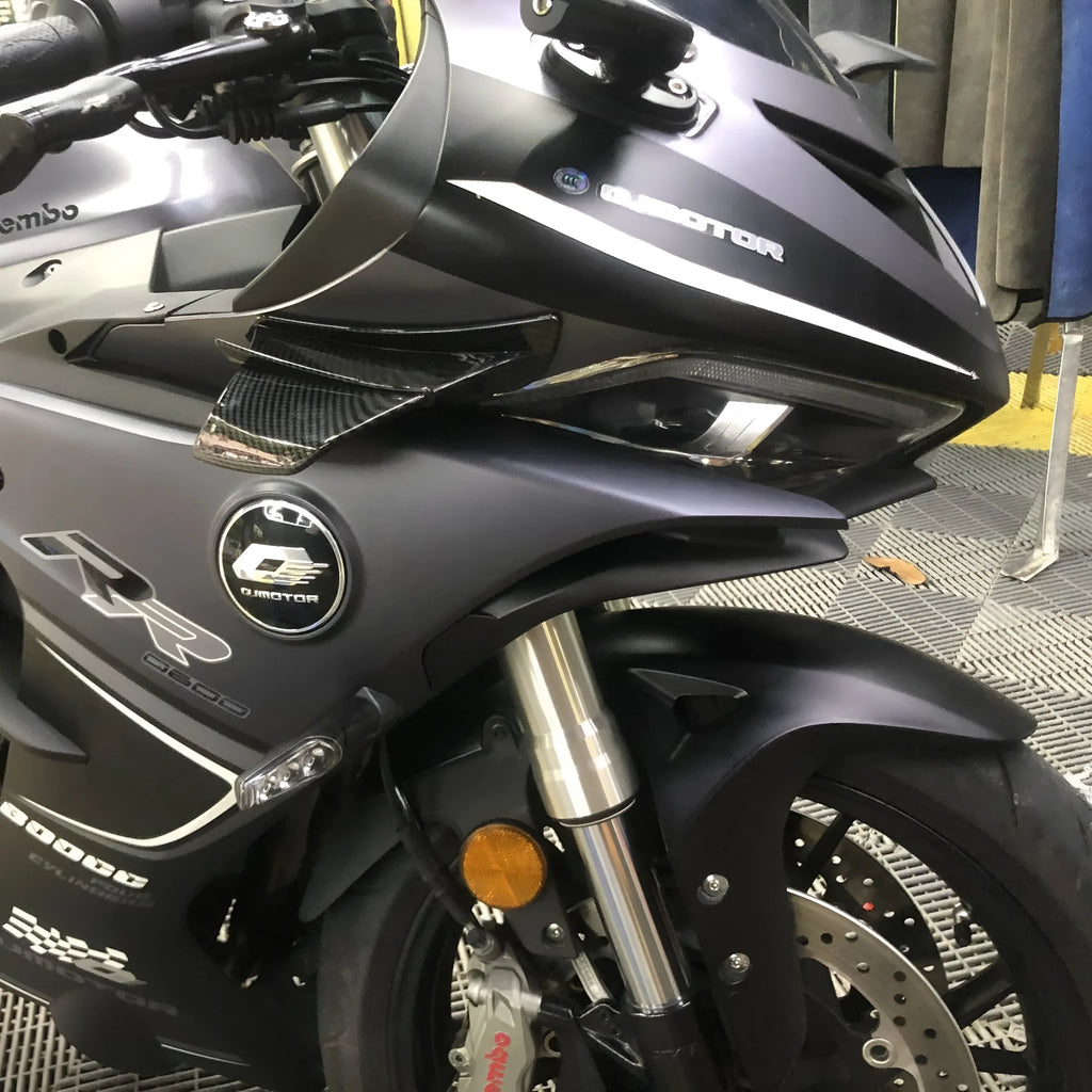 Universal motorcycle spoiler wing with four glossy finish options including forged and carbon fibre patterns