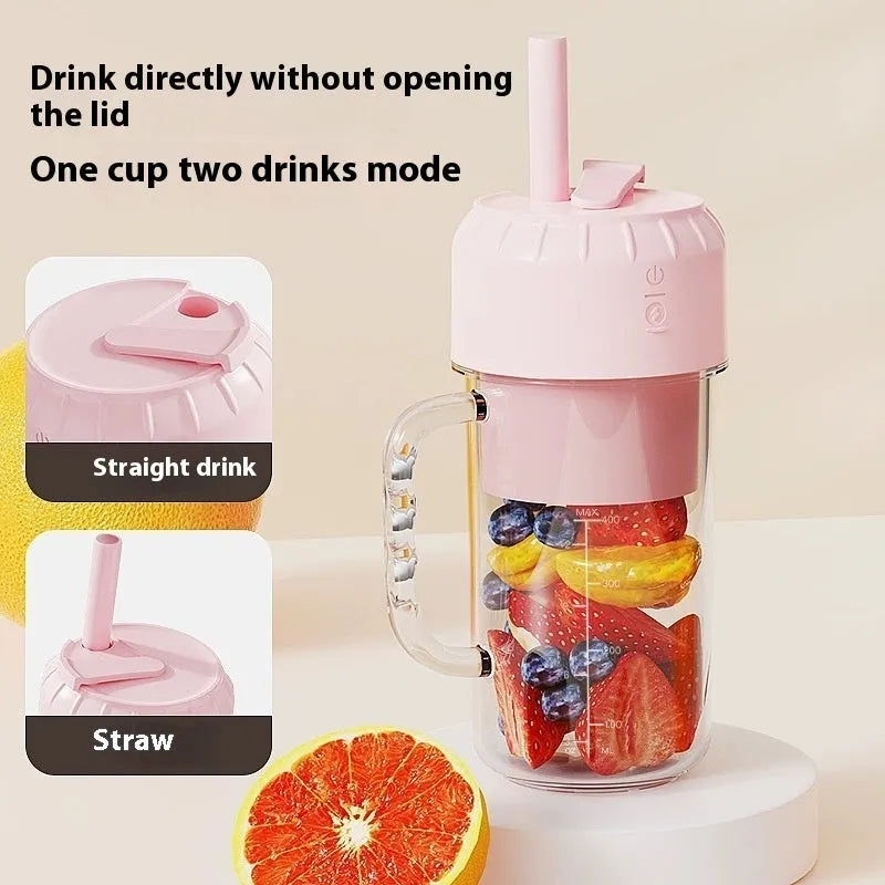 Portable USB charging personal juicer in cherry blossom pink or avocado green colour on a table.