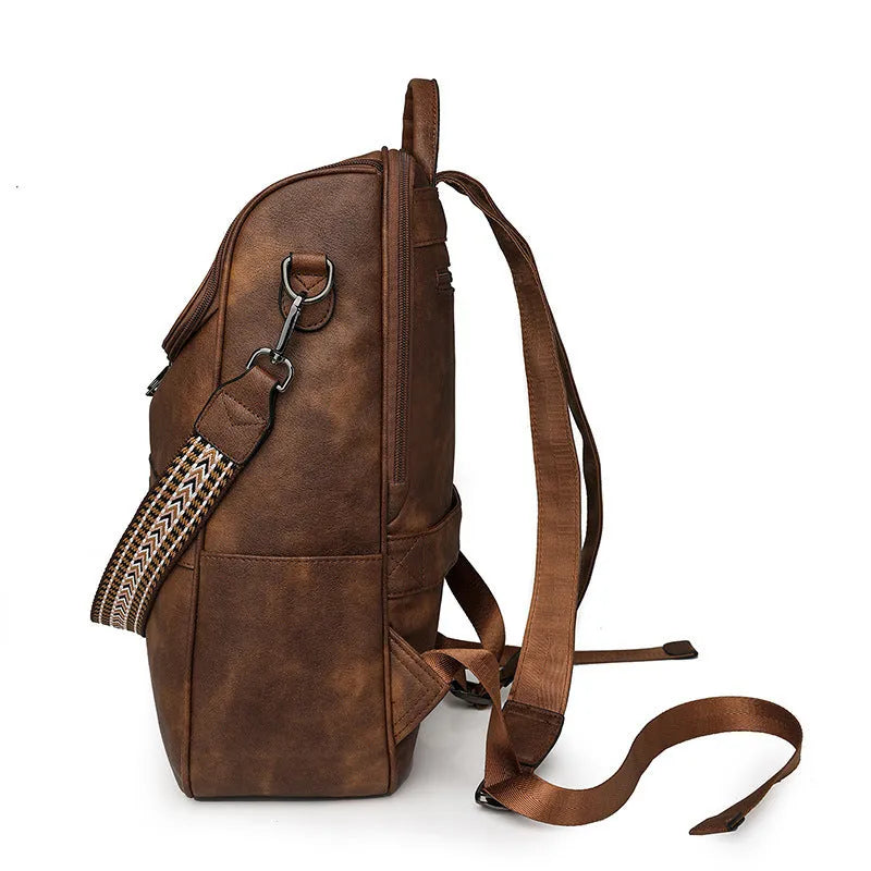 PU leather college backpack with curved shoulder strap in solid colour with stitching detail.