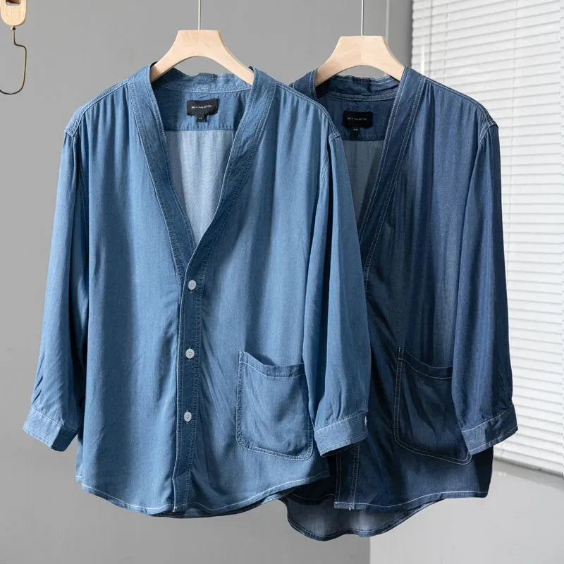 Men's dark blue casual denim coat with three-quarter sleeves and a V-neck collar.