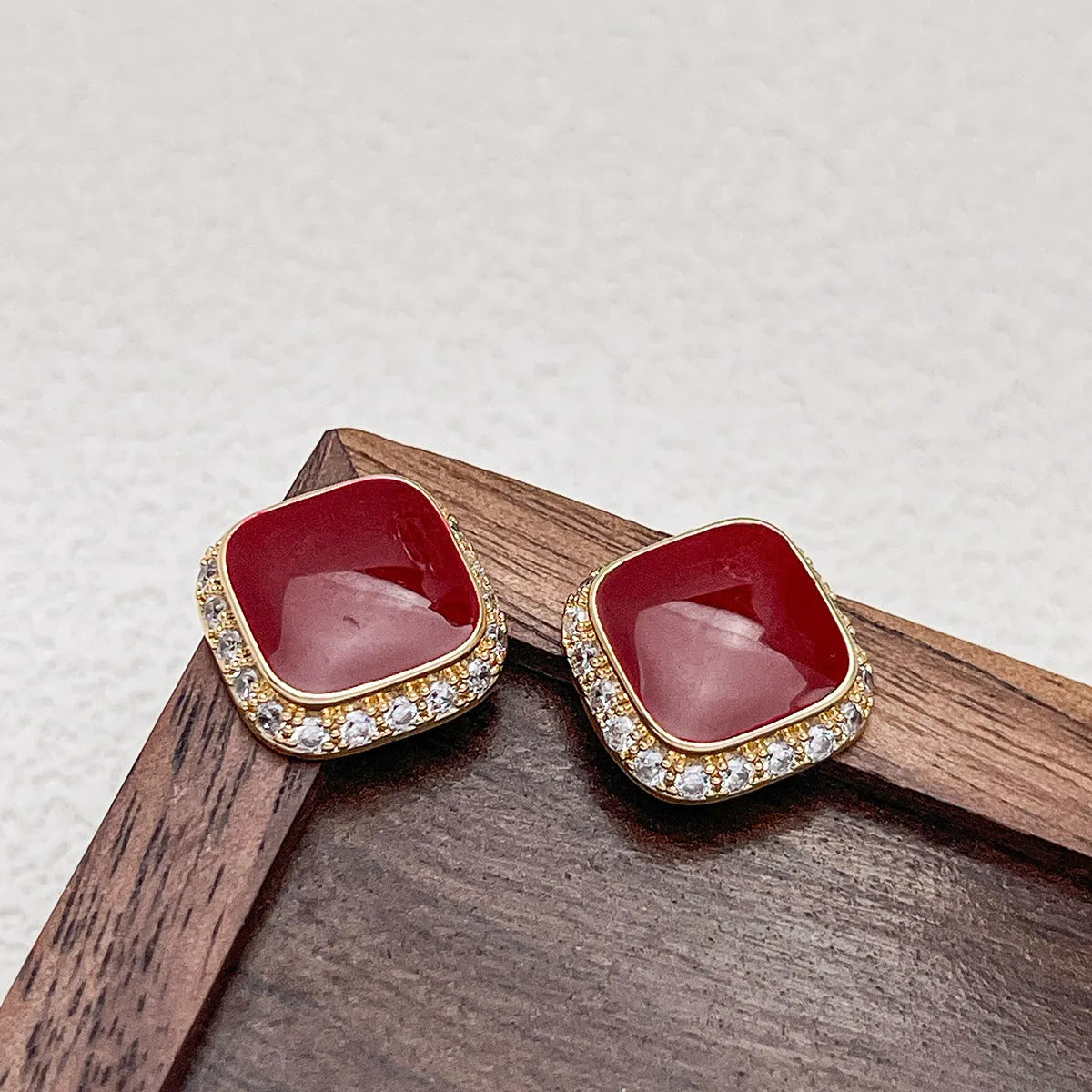 Retro red alloy earrings with geometric square inlaid design for women.