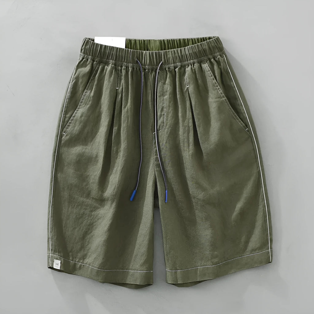 Men's loose straight leg linen shorts in green with drawstring waist and mid thigh length