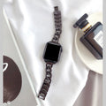 Stainless steel single row denim chain watch strap 180mm in silver colour on a dark background