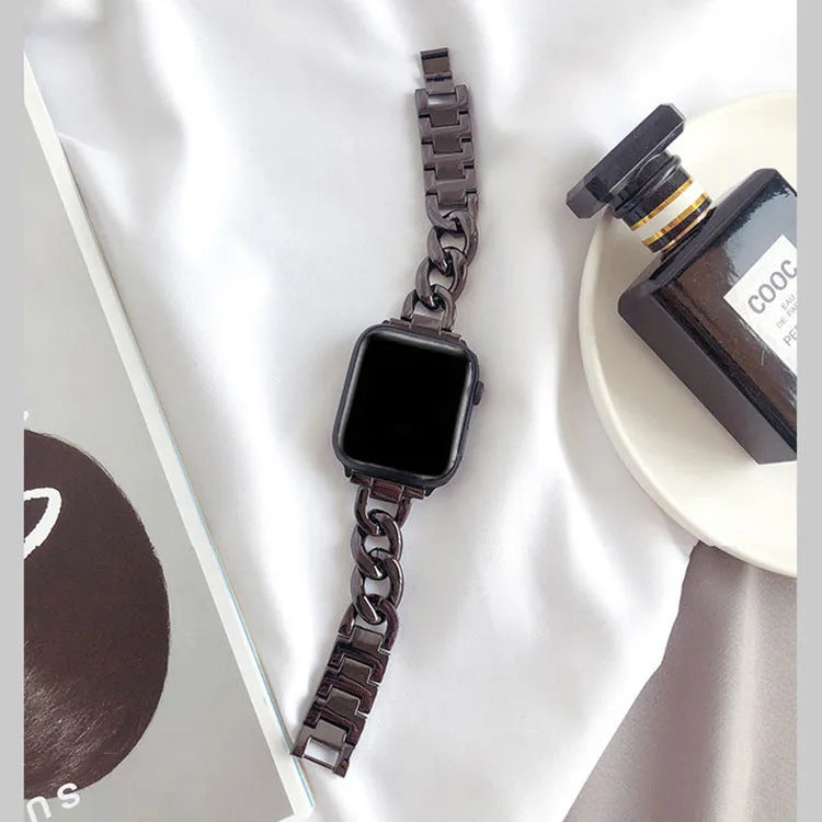 Stainless steel single row denim chain watch strap 180mm in silver colour on a dark background