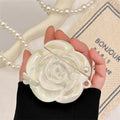 Pearl white camellia silicone AirPods case with lanyard, laser pearlescent finish