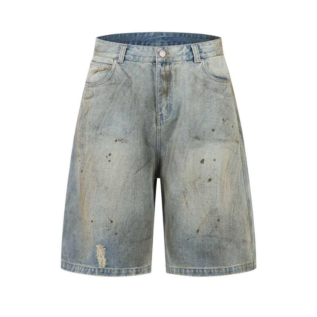 Blue washed straight leg denim trousers showing mid-length cut and zipper fly detail