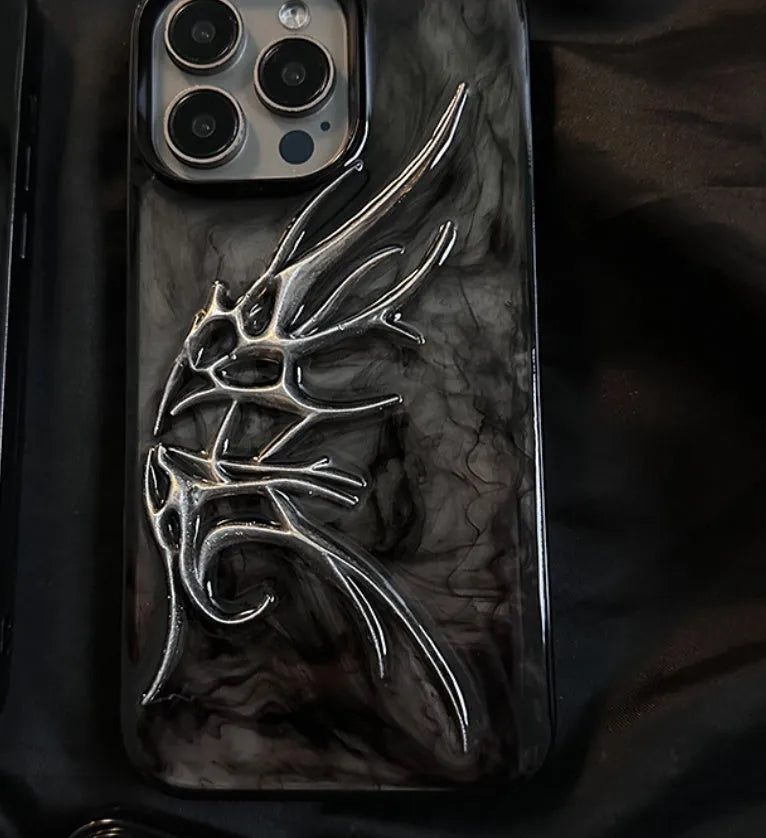 Black iPhone case with three-dimensional blurred wings design showing raised edges and precise port cutouts