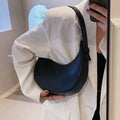 Women's retro-style PU leather shoulder bag in a dumpling shape, shown in black.
