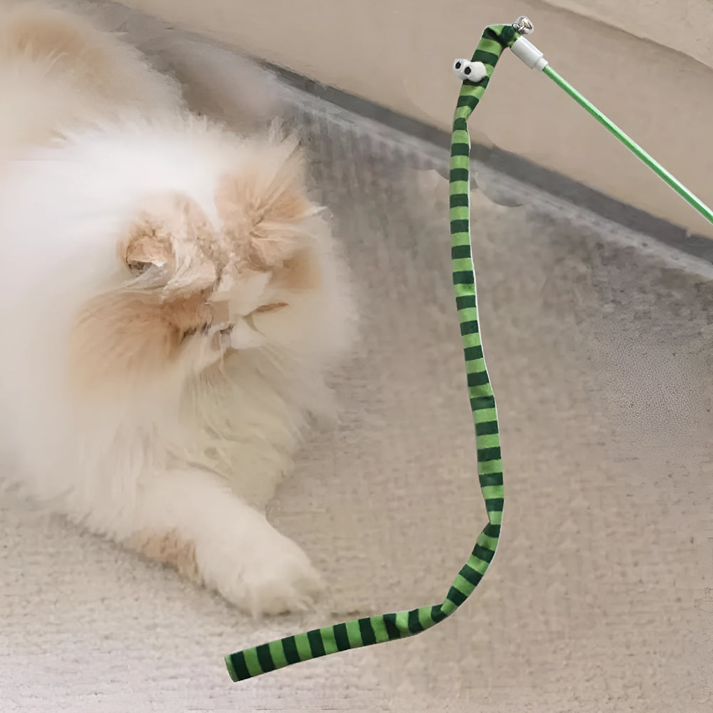 Cat wand teaser toy with a polycarbonate handle and a long green plush strip with a bell.