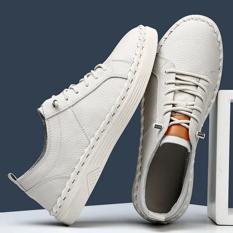 Men's beige and black round toe casual sneakers made from first layer cowhide with visible stitching.