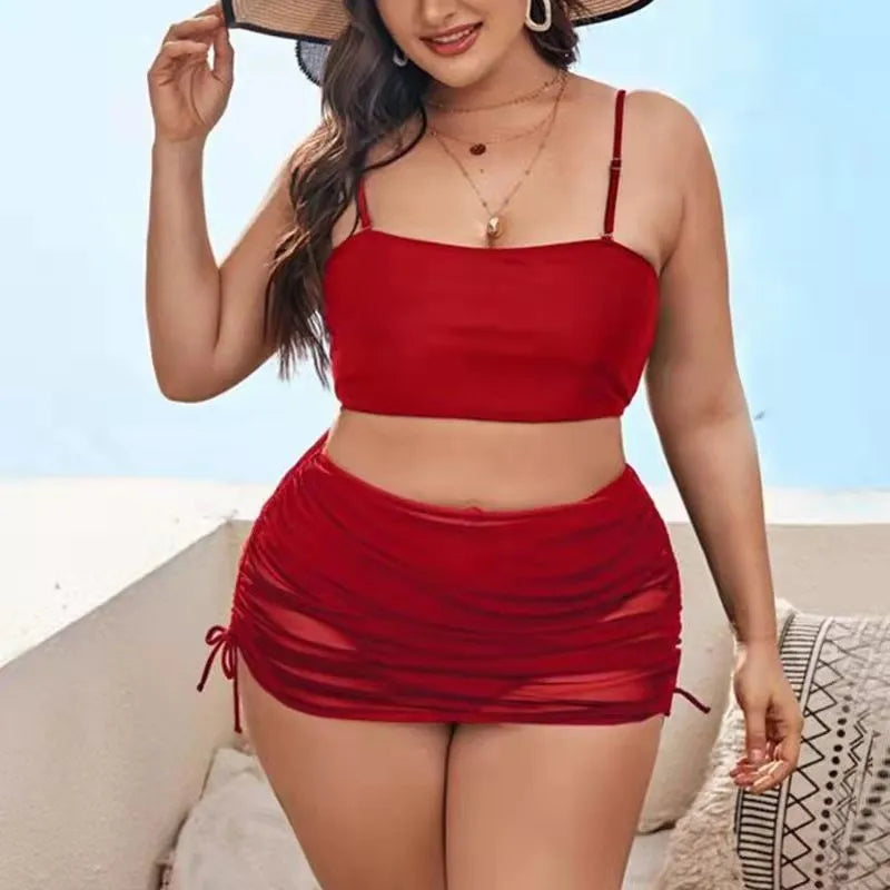 Women's solid colour mesh bikini three-piece set with apron on a mannequin.
