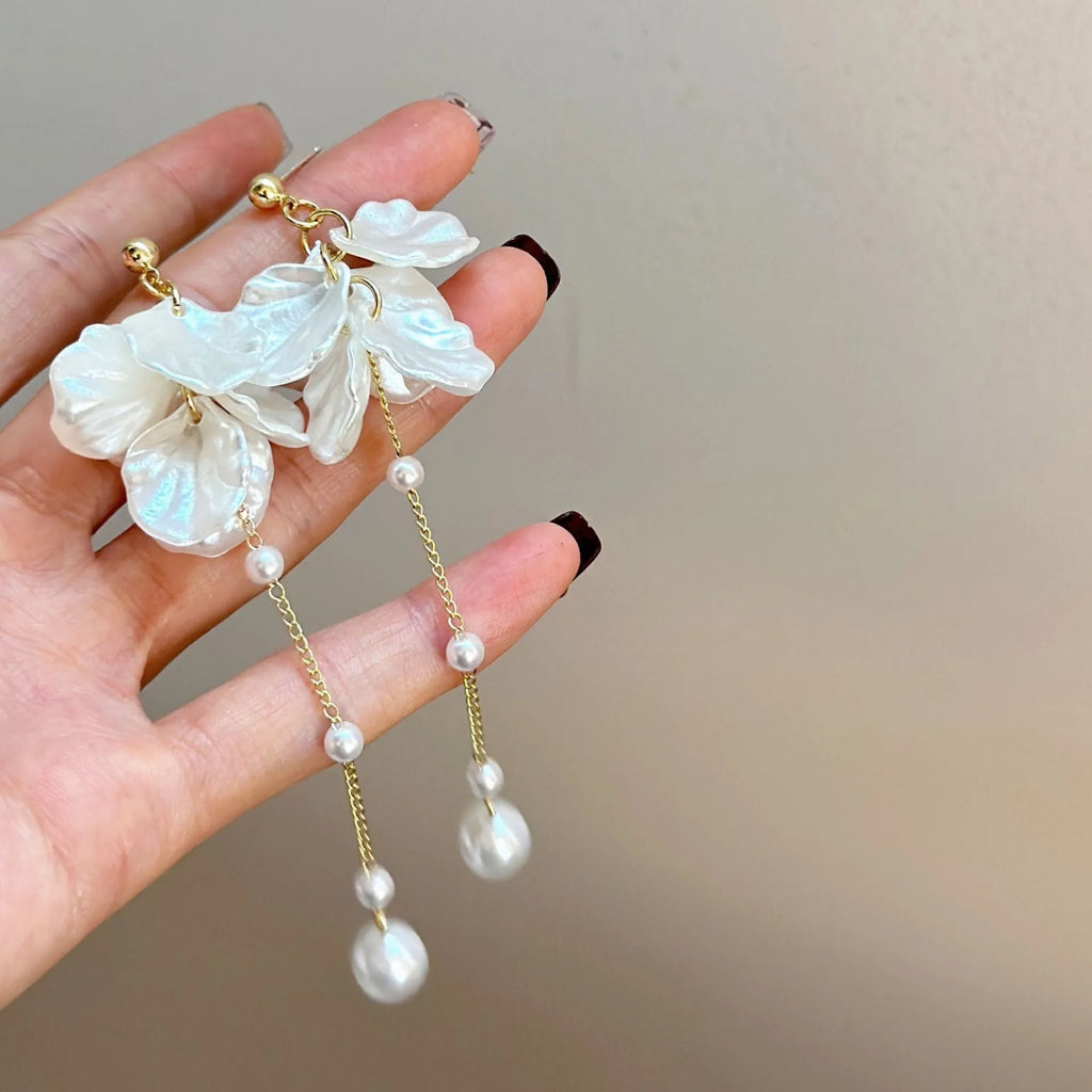 Women's acrylic pearl tassel earrings with four attachment styles showing 8.8cm length